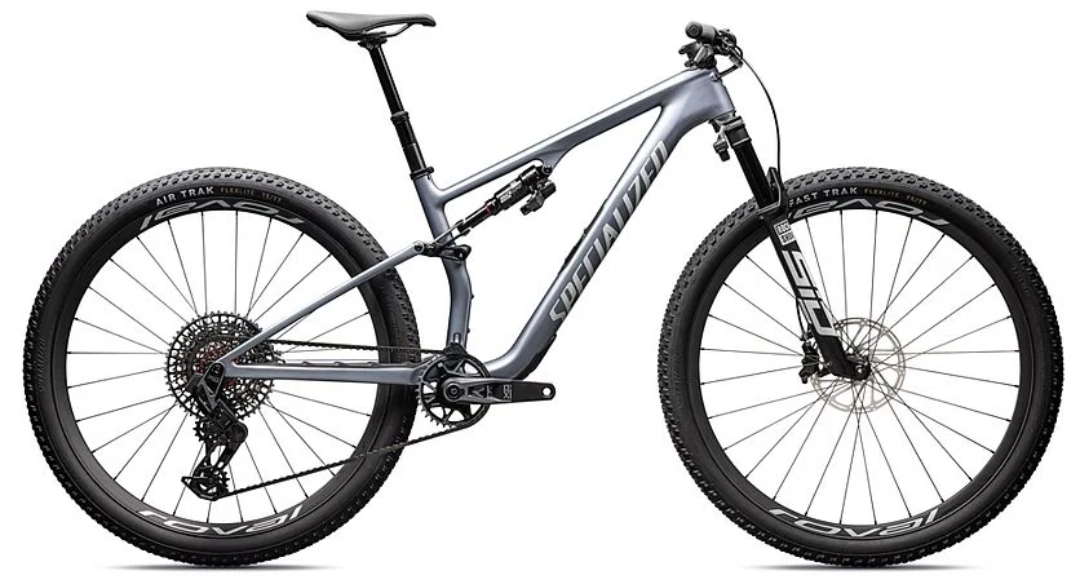 Product photograph of Specialized Epic 8 Pro bicycle in side profile on white background, metallic bluish-gray carbon frame, compact dual suspension, white front suspension fork, Fast Trak tires with XC tread pattern, hydraulic disc brakes, SRAM 12-speed cassette, dropper seatpost, lightweight design for cross-country epic-8-pro-specialized-xc-1