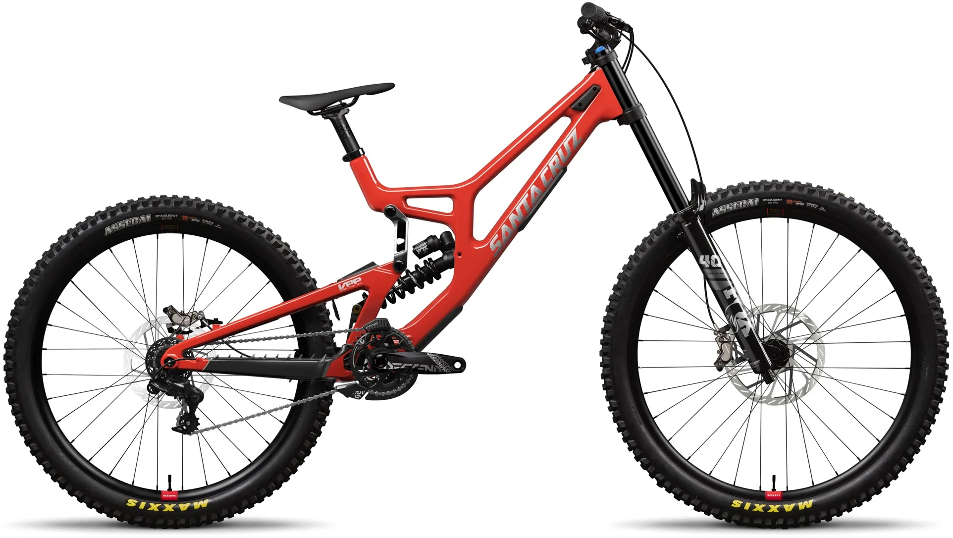 Product photograph of Santa Cruz V10 G8 bicycle in side profile on white background, bright red carbon frame with silver logo, dual suspension with visible rear coil shock, black long-travel downhill fork, Maxxis Assegai tires with aggressive knobs, 27.5-inch wheels, large disc brakes, single-speed drivetrain, slack geometry specific for downhill racing