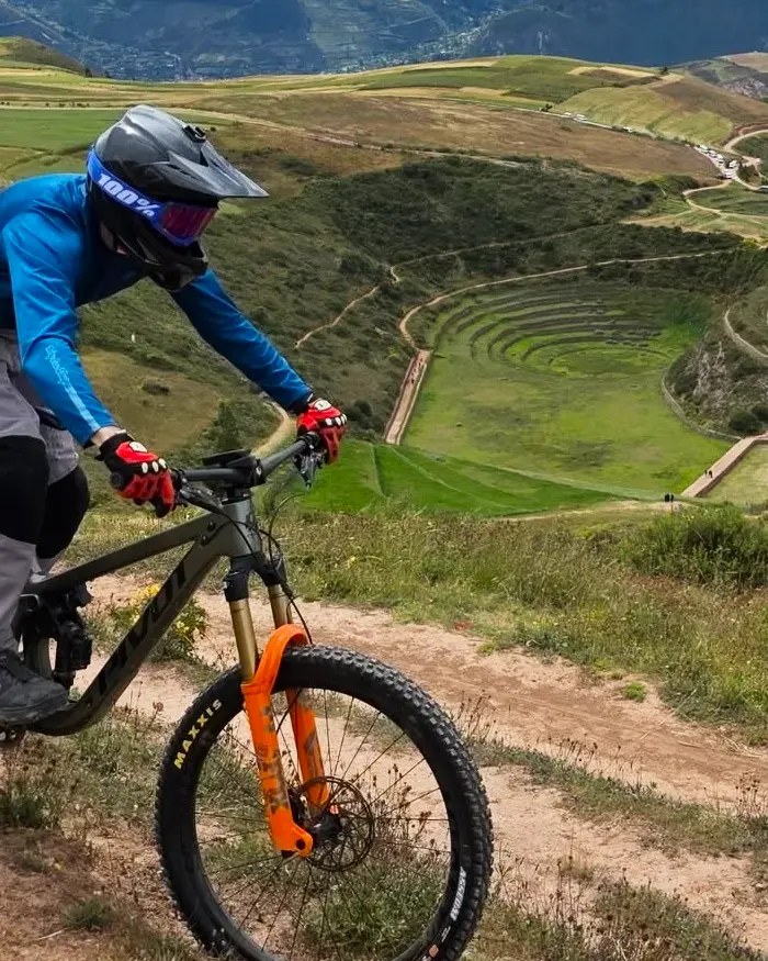 The dirt trail winds along the hillside, tracing gentle curves before reaching Moray.