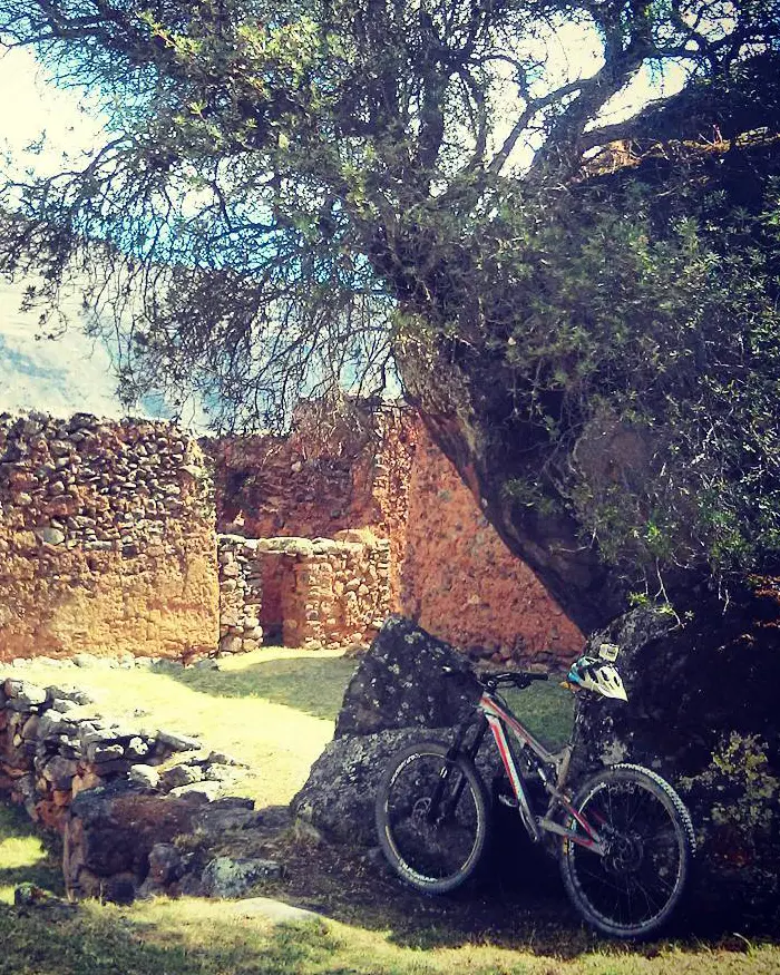 The bike suggests the recent presence of a rider exploring this remote site.