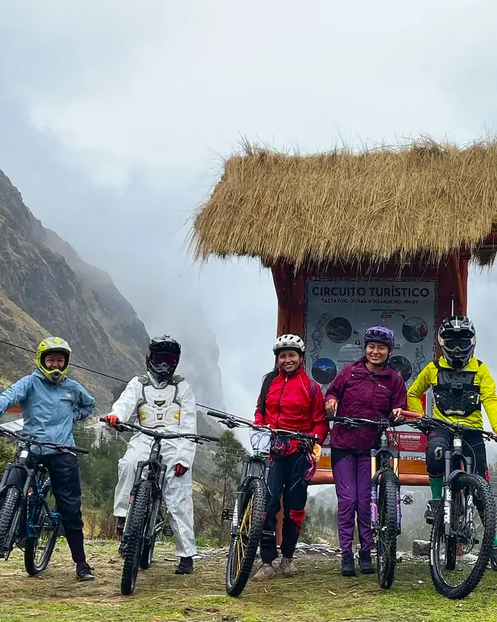 They are all wearing helmets and technical gear, prepared for demanding mountain conditions.
